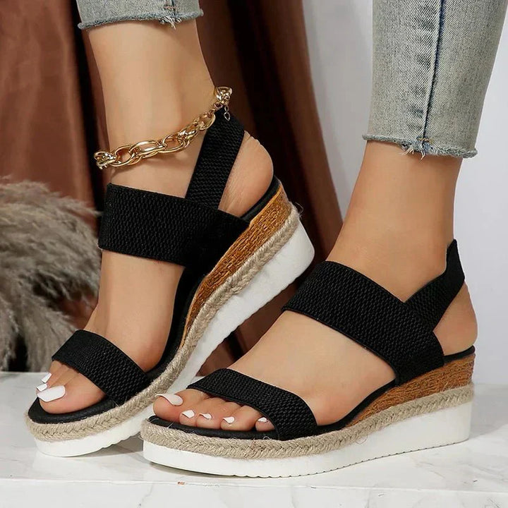 Close-up of adaptive women's platform sandals, showing the comfortable, stretchy upper straps.