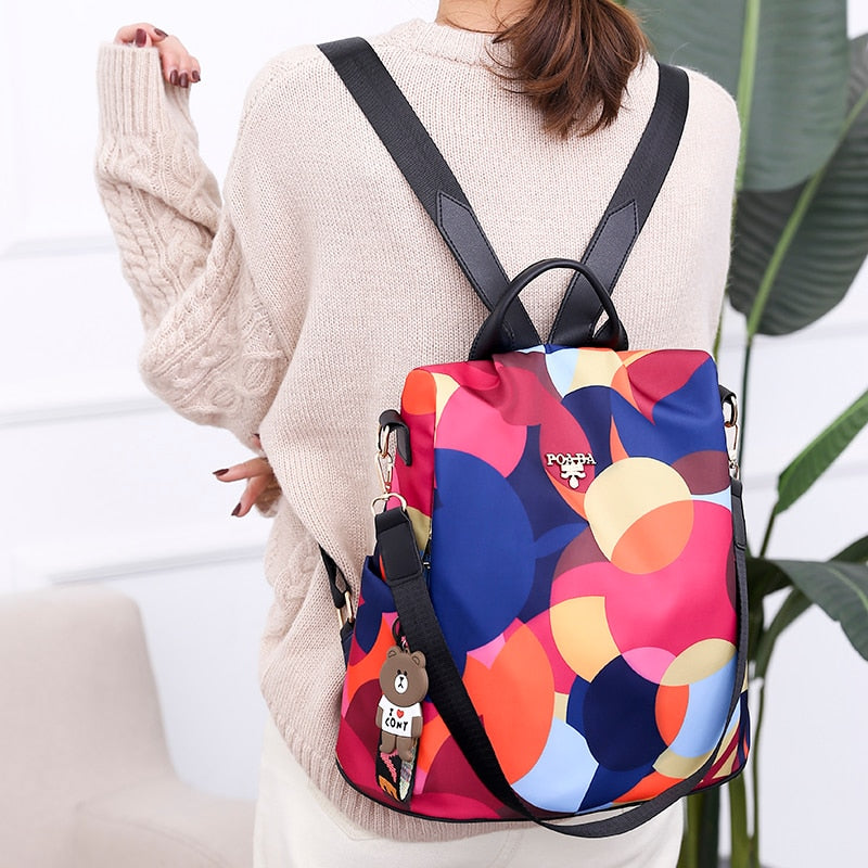 Women's anti-theft backpack, water-resistant PU leather, multiple compartments for secure daily travel.