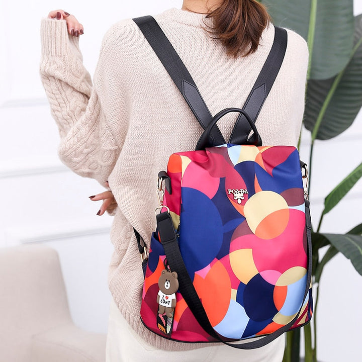 Women's anti-theft backpack, water-resistant PU leather, multiple compartments for secure daily travel.