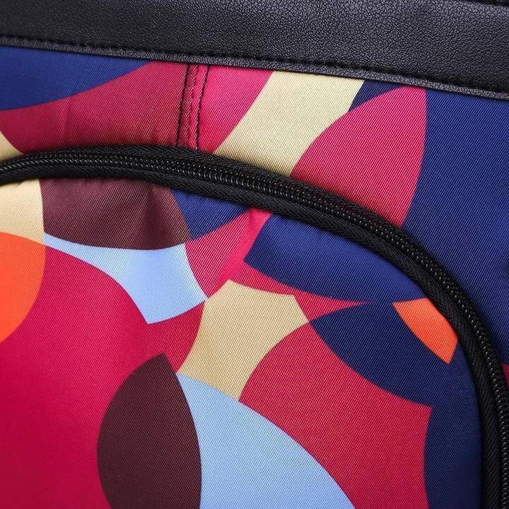 Interior of a women's anti-theft backpack showing multiple organizer compartments for tech and essentials.