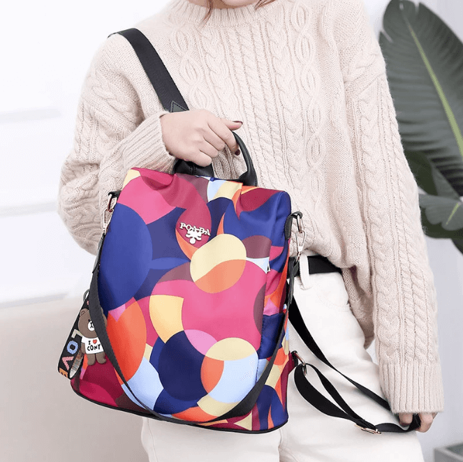 Detail of the hidden zipper and secure back pocket of the SafeHold anti-theft women's travel shoulder bag.