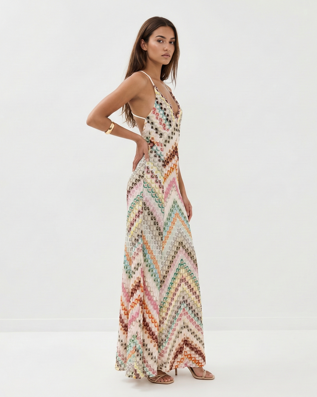 Elegant women's striped maxi dress with a V-neck and backless design, ideal for evening wear & special occasions.
