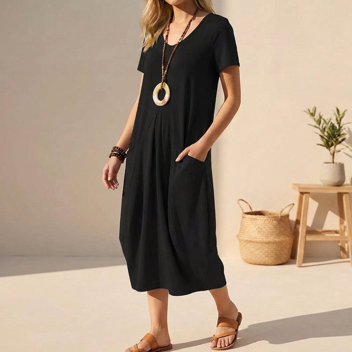 Black women's V-neck casual midi dress with practical pockets, short sleeves, and relaxed fit for summer.