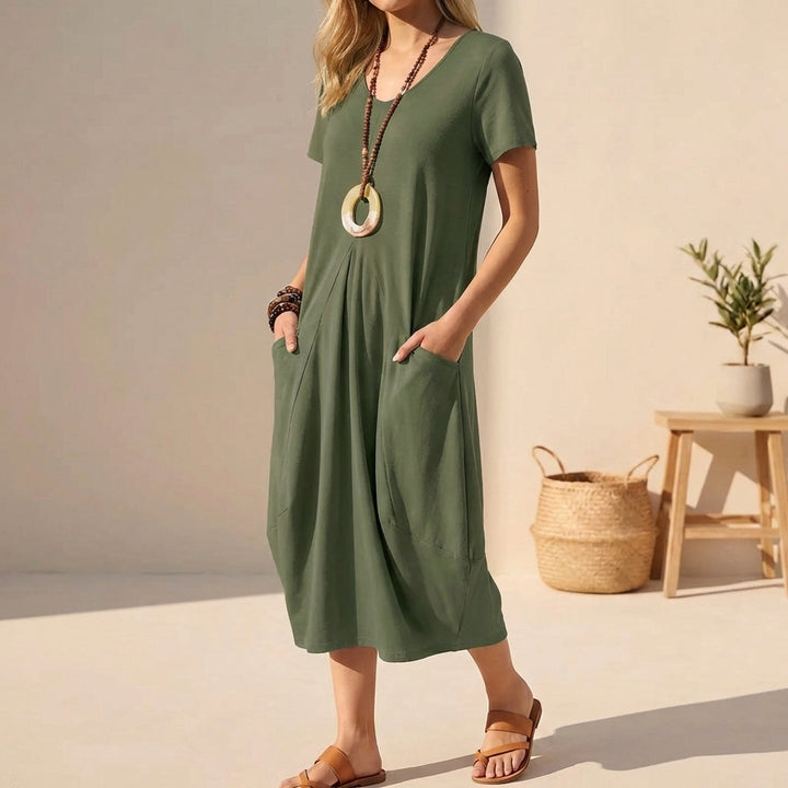 Green comfortable midi dress for women featuring a V-neck, short sleeves, and pockets, perfect for versatile daily wear.