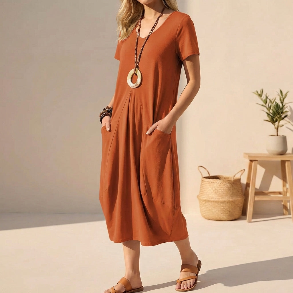 Orange casual women's midi dress with an effortless V-neck style, short sleeves, and convenient pockets for summer.