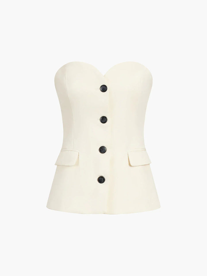 Woman wearing elegant beige corset top and wide leg pant two-piece set, perfect for parties.