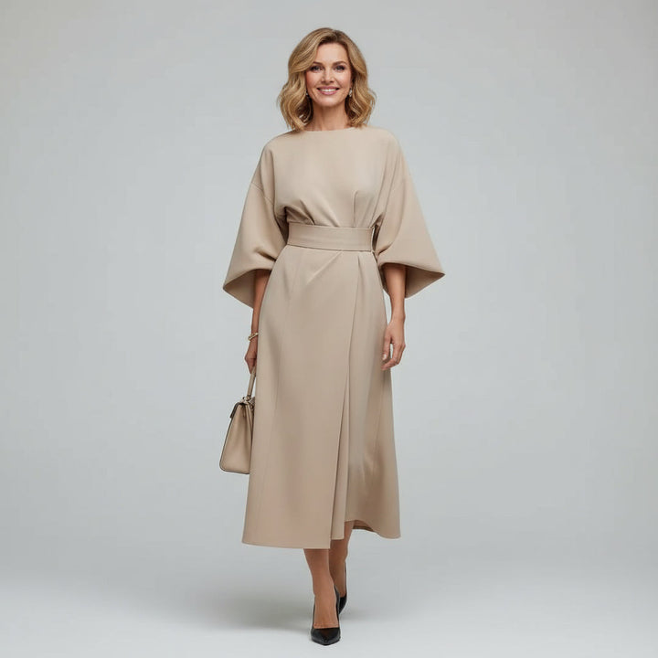 Flowing women's midi dress with a flattering belt and stylish wide sleeves, ideal for day or evening wear.