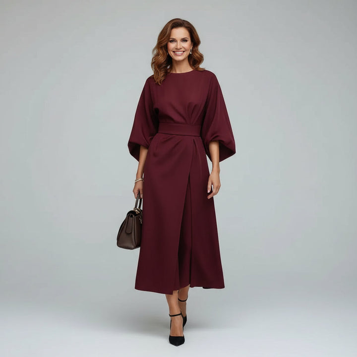 Elegant women's midi dress. Features a chic belt and wide, flowing sleeves. Great for a sophisticated look.