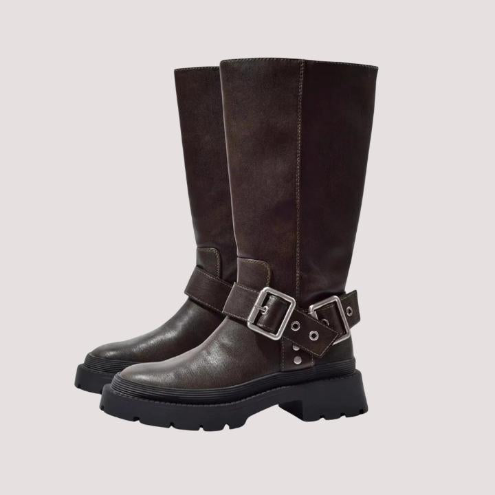 Women's black buckle strap knee-high boots with chunky sole for stylish fall and winter fashion.