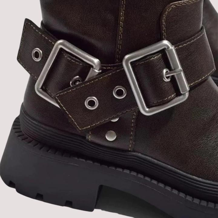 Stylish women's knee-high buckle strap boots, ideal fall and winter footwear for a chic look.