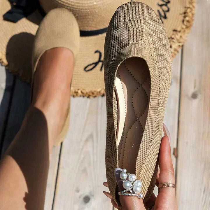 Women's office-ready ballet flats, comfortable slip-on design for professional & stylish wear.