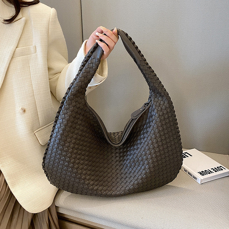 Women's bohemian braided hobo bag in woven leather, perfect shoulder bag for casual everyday style.