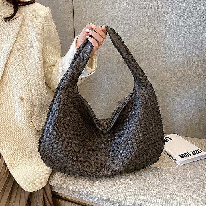 Women's bohemian braided hobo bag in woven leather, perfect shoulder bag for casual everyday style.