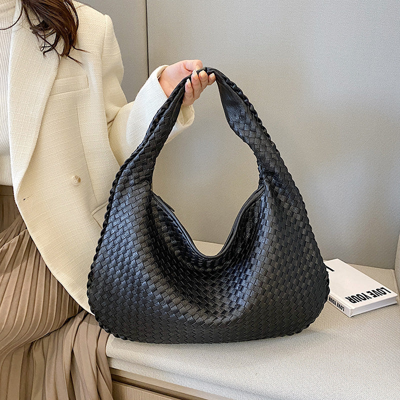 Spacious women's hobo handbag, a stylish bohemian braided shoulder bag for daily essentials and fashion.