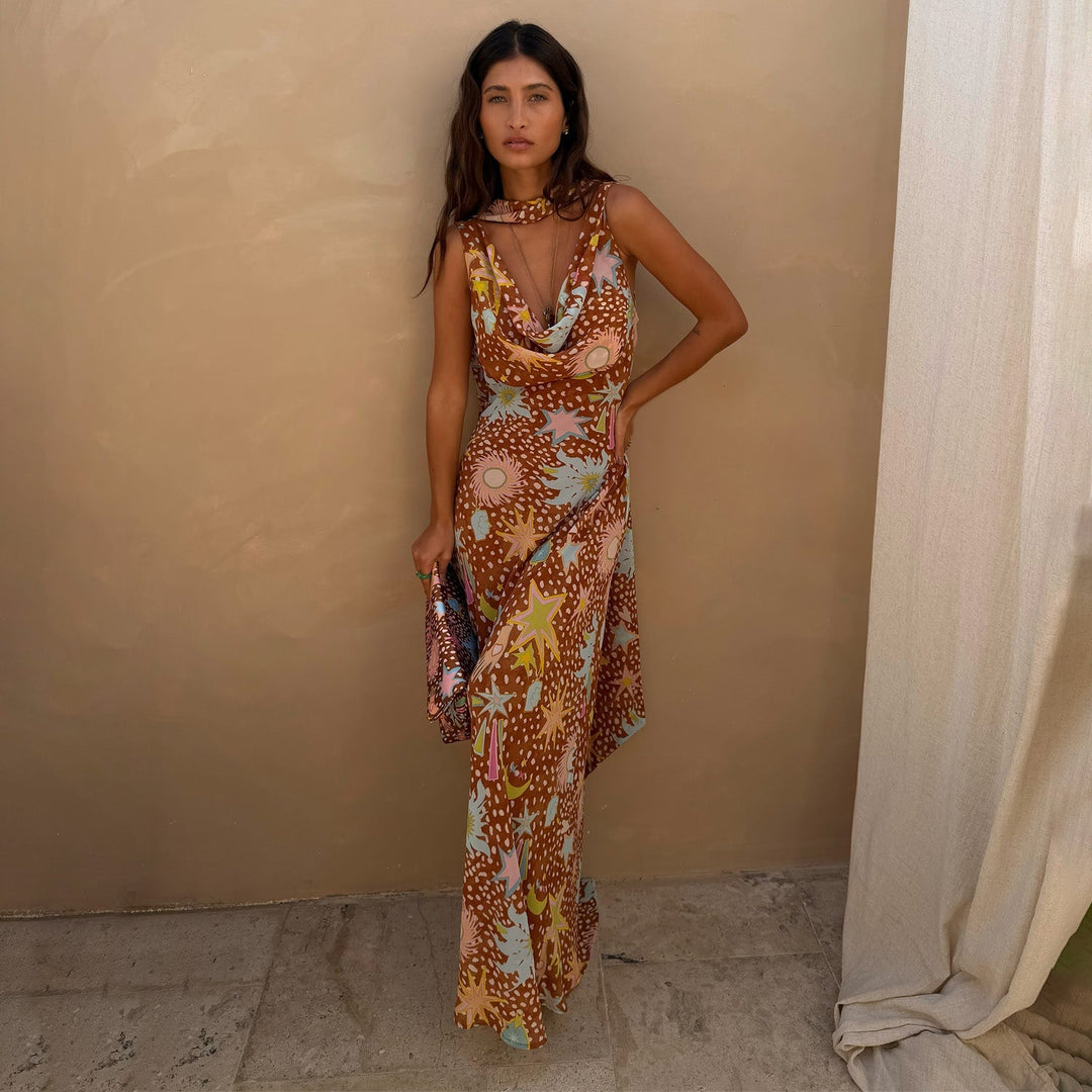 Close-up of elegant cowl neck and halter detail on women's brown fawn print maxi dress.