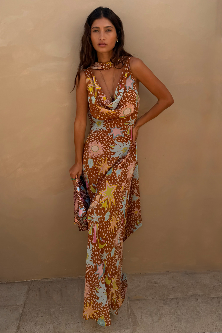 Detailed view of brown fawn animal print fabric on women's flowy cowl neck house dress.