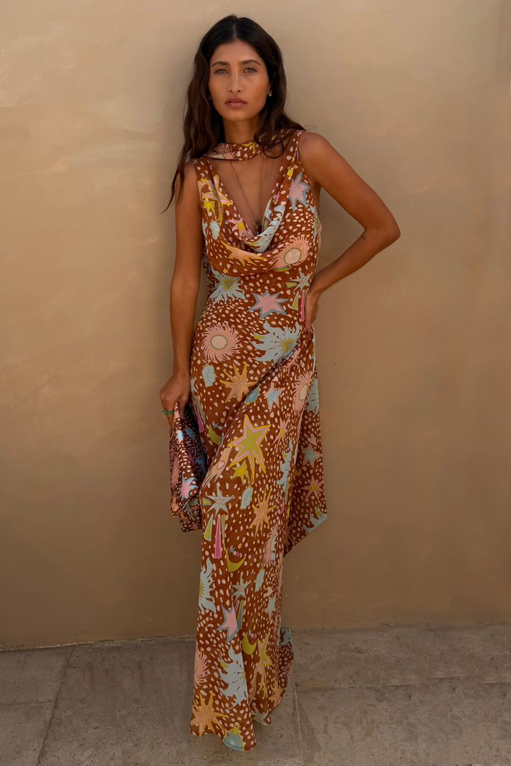 Detailed view of brown fawn animal print fabric on women's flowy cowl neck house dress.