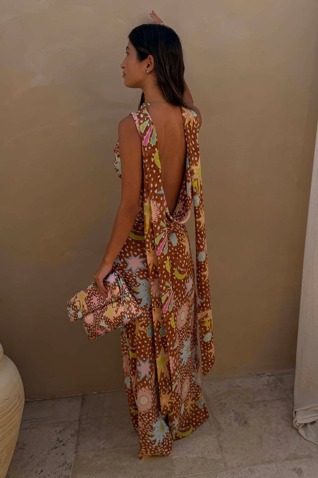 Back view of women's brown fawn print maxi dress, showcasing low back and flowy design.