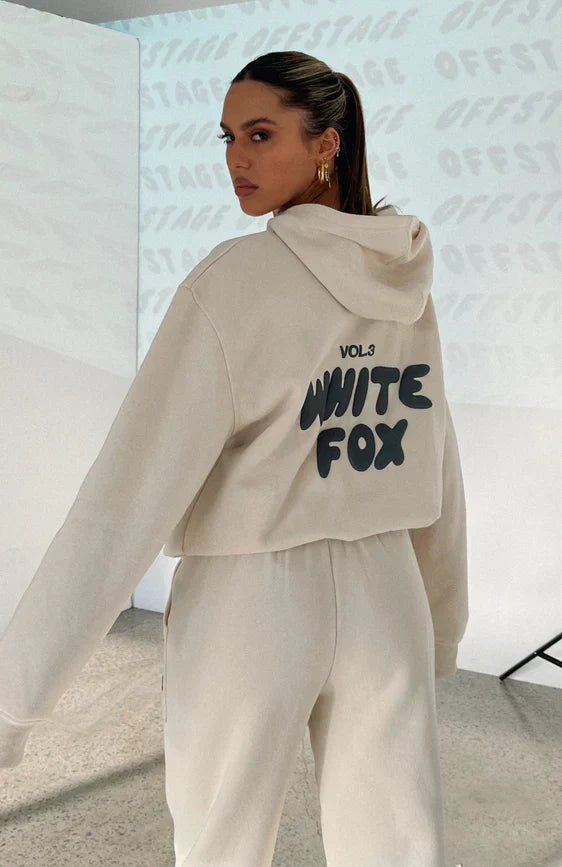 Women's casual cropped tracksuit with unique back print. Comfortable 2-piece athleisure set for street style.