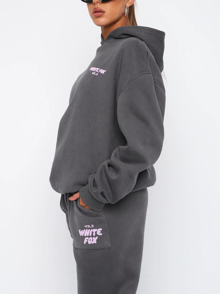 Versatile women's athleisure tracksuit. Cropped hoodie and joggers for casual wear, loungewear, or street fashion.