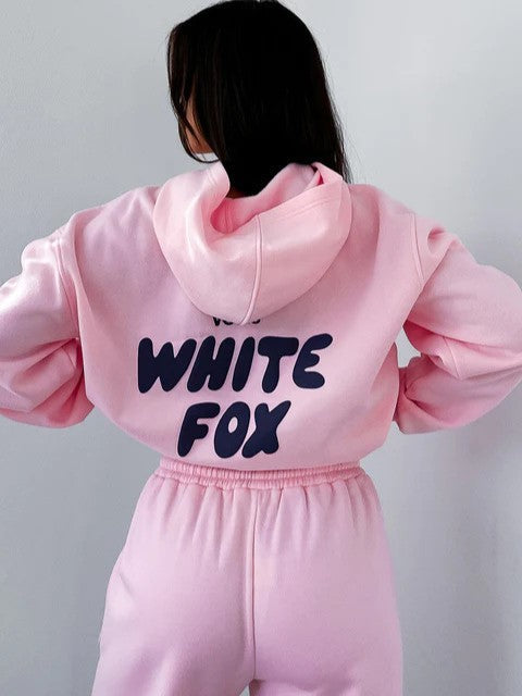 Womens casual cropped tracksuit for athleisure & comfort. Two-piece set with stylish back print, perfect for daily wear.