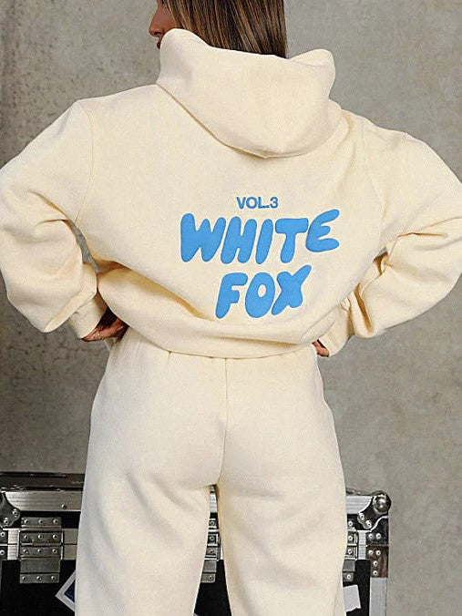 Women's comfortable cropped tracksuit, ideal for loungewear or street style. Two-piece set with unique back print detail.