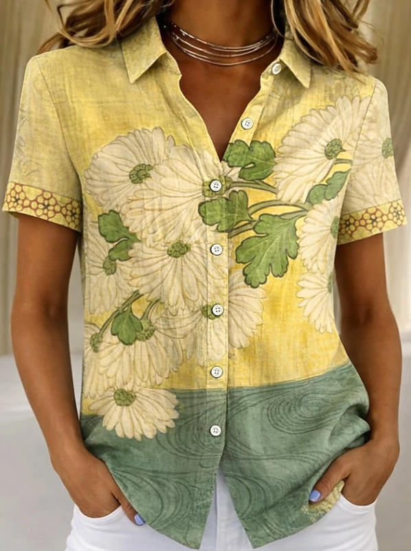 Front view of women's casual floral button-up shirt. Short sleeve summer blouse with vibrant print for fashion.