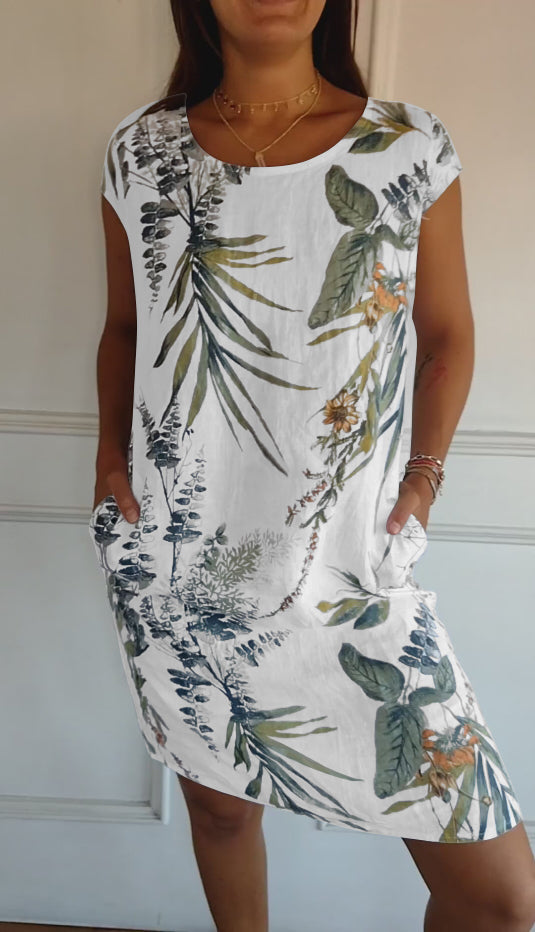 Women's casual leaf print midi summer dress with practical patch pockets and a flattering V-neck.