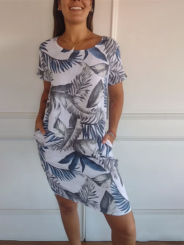 Relaxed fit women's summer midi dress, featuring a vibrant leaf print and comfy short sleeves for warm weather.