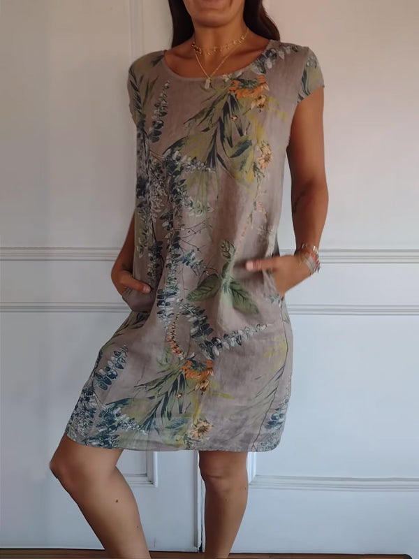 Stylish day dress: women's leaf print midi with pockets, perfect for casual outings or holiday wear.