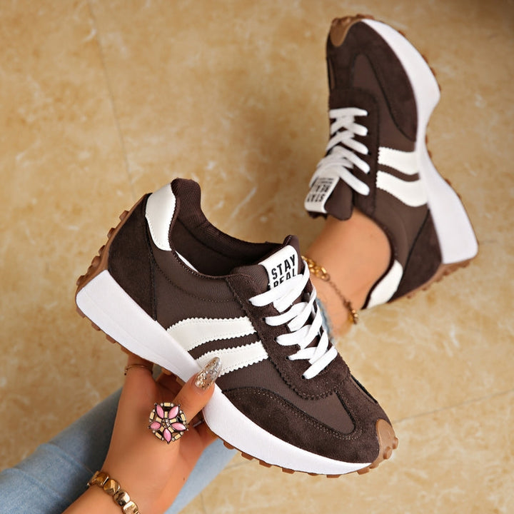 Stylish women's casual retro trainers, providing comfort and a chic look for everyday wear.