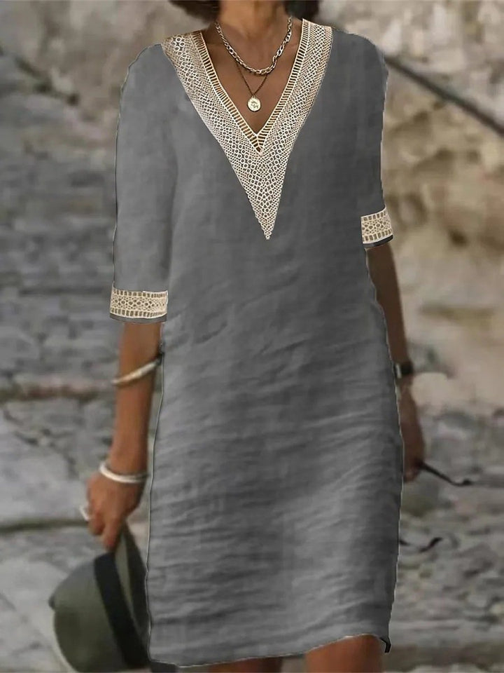 Women's casual V-neck lace trim dress, knee-length, with three-quarter sleeves for comfortable everyday wear.