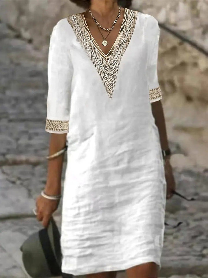 Chic women's casual dress with V-neckline & beautiful lace trim detailing, ideal for versatile everyday fashion.