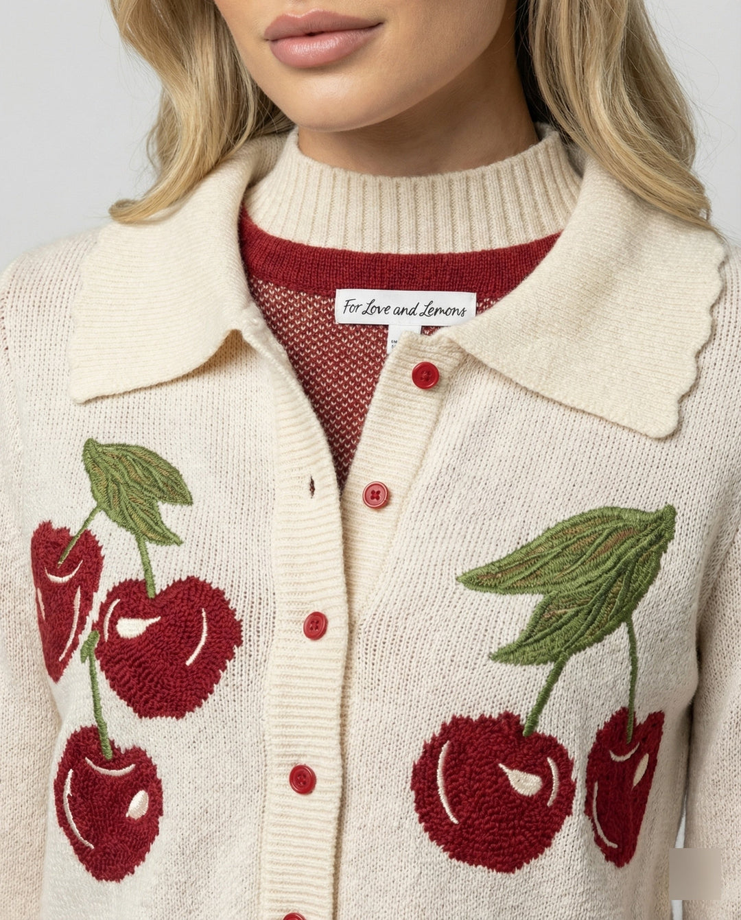 Vibrant knit women's cropped floral jacket, a stylish layering piece for spring & summer fashion.
