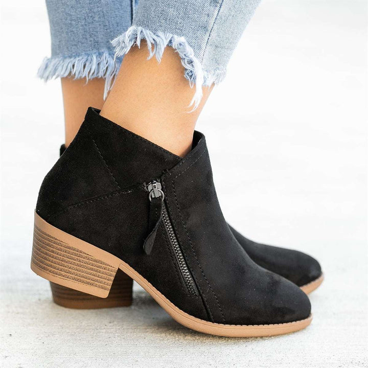 Chic women's ankle boots with zipper & comfortable block heel. Versatile ladies shoes for casual or dressy looks.