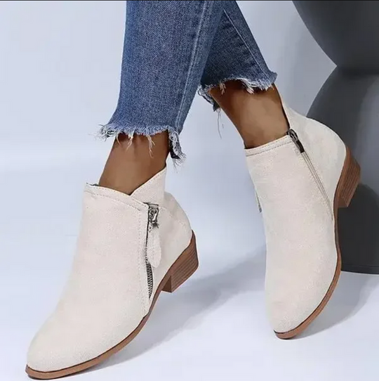 Elegant women's ankle boots with a practical zipper closure. Durable and chic ladies' footwear for all seasons.