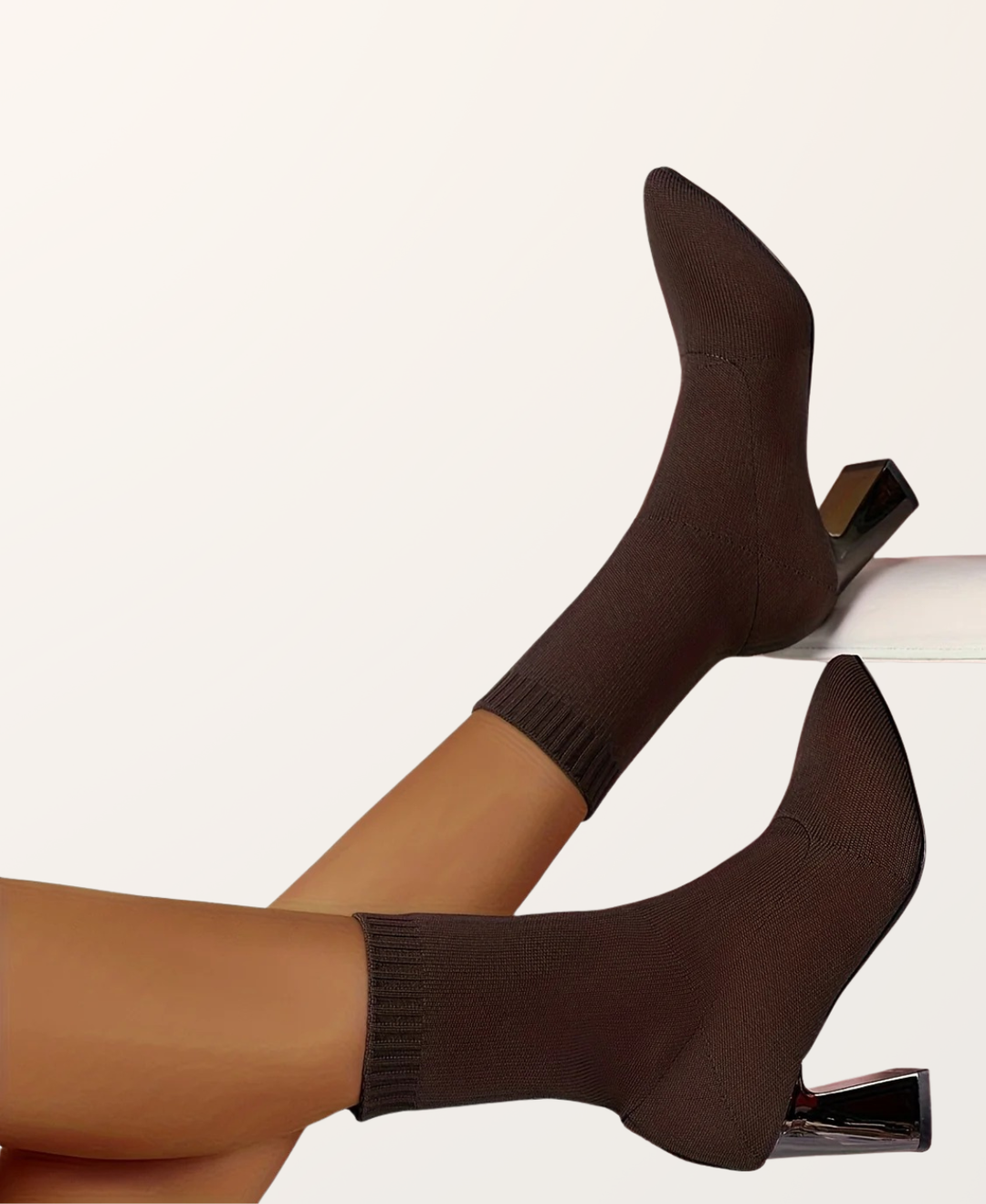 Stylish women's black high heel sock boots, perfect for formal or casual wear. Features a sturdy block heel.