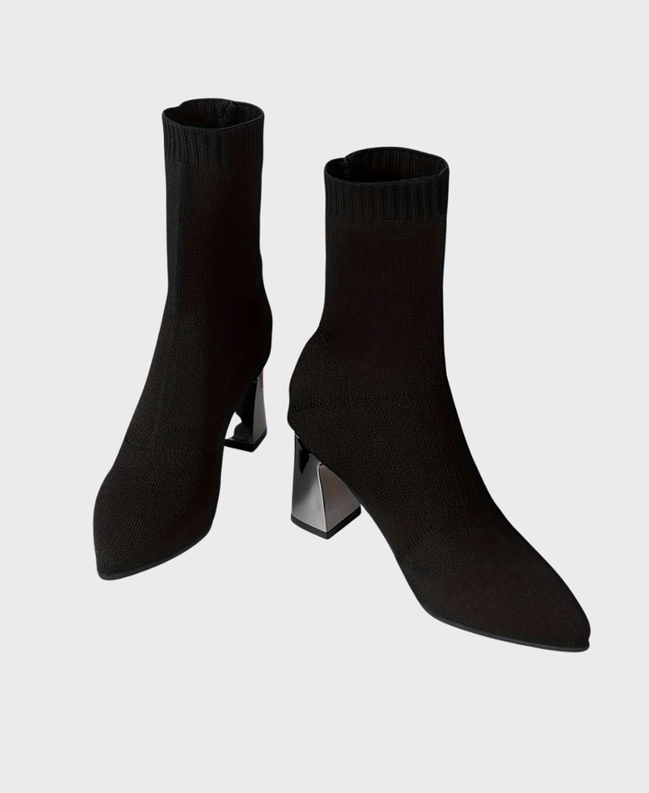 Side view of a women's black high heel sock boot, showcasing the elegant block heel and sleek silhouette.
