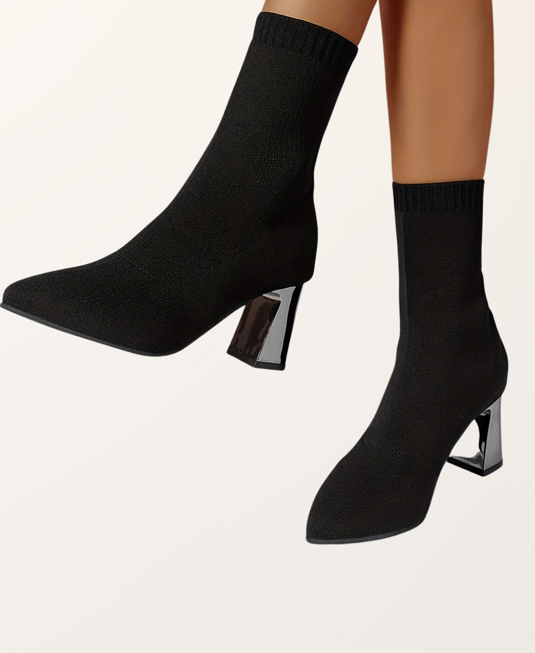 Front view of women's chic black pointed toe sock boots. Versatile high heel footwear for any occasion.