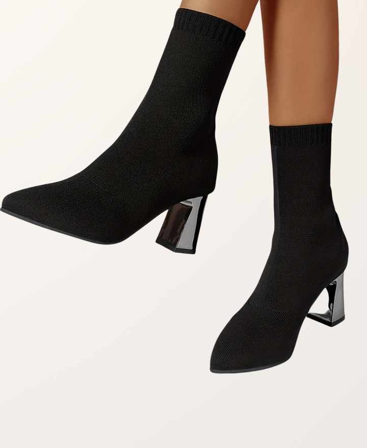 Front view of women's chic black pointed toe sock boots. Versatile high heel footwear for any occasion.