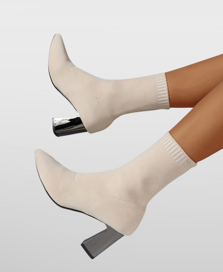 Pull-on women's black high heel sock boots with a pointed toe & elegant block heel. Comfortable and stylish footwear.