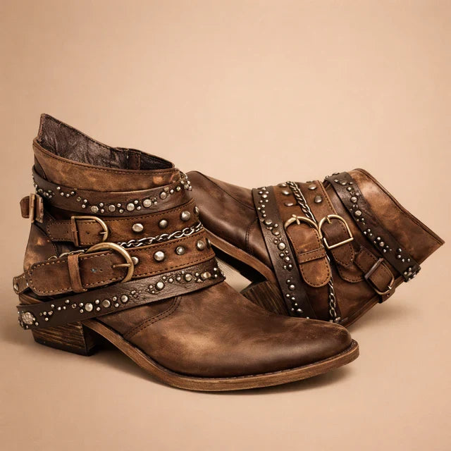 Women's chic black pointed-toe cowboy boots with western stitching; ideal for stylish casual outfits.