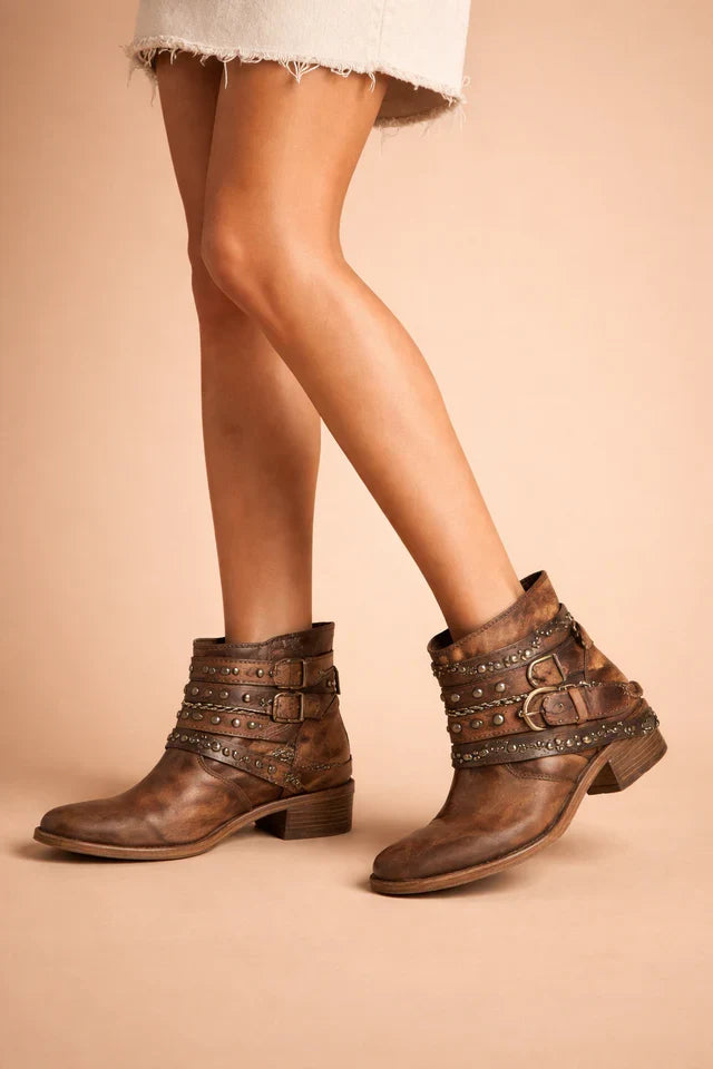 Brown leather women's cowboy boots featuring a sharp pointed toe & intricate western embroidery, a timeless fashion boot.