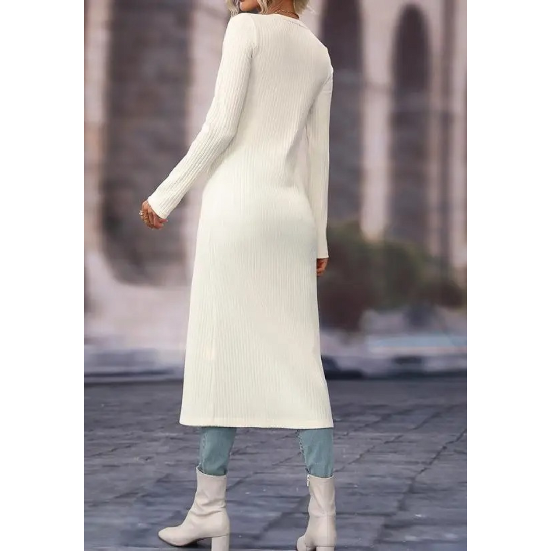 Detail of the chic button closure & V-neck on a women's comfortable longline jacket, highlighting stylish outerwear.