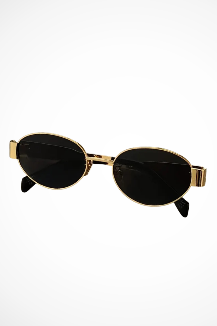 Women's oval metal frame fashion sunglasses with dark lenses, combining style, comfort, and UV protection.