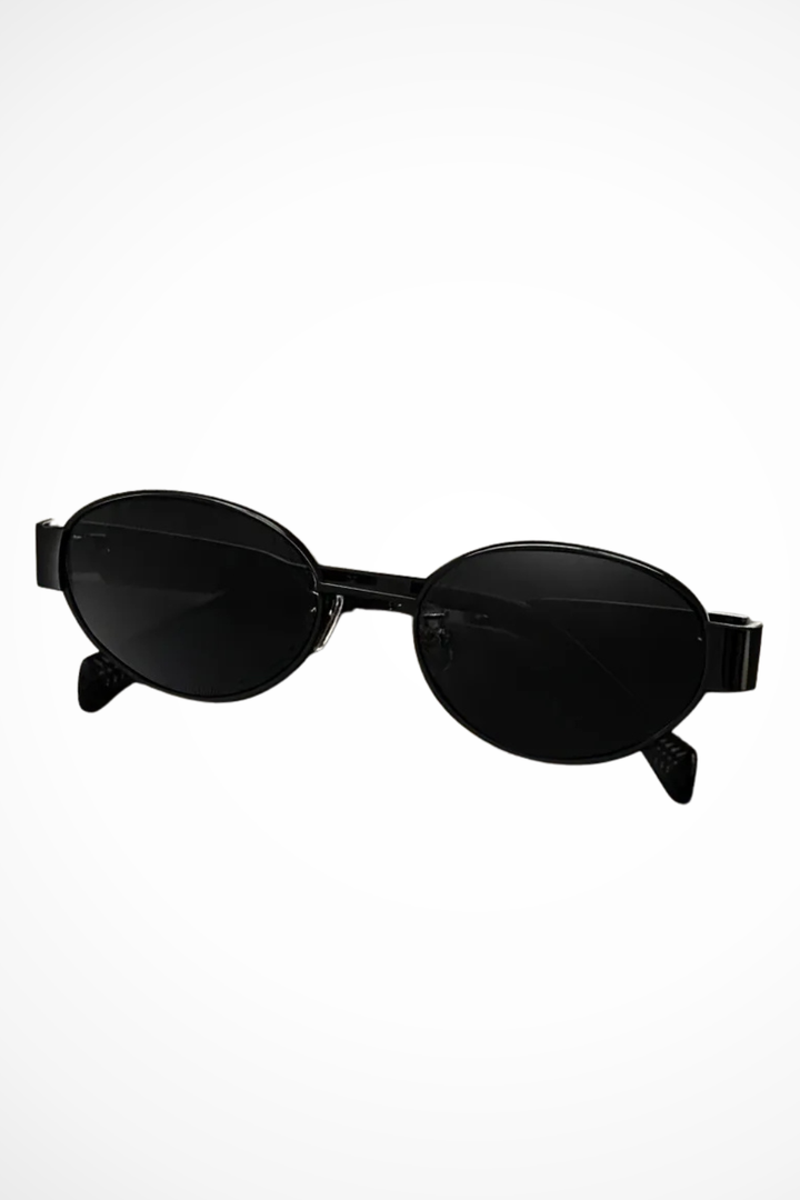 Fashionable women's oval sunglasses with a sturdy metal frame and dark tint lenses, ideal for daily wear.