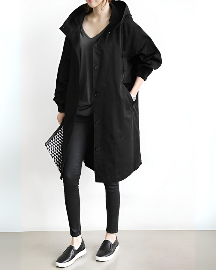 Women's classic hooded trench coat for autumn/winter. Stylish, single-breasted outerwear for effortless elegance.