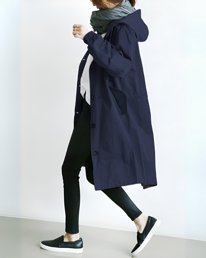 Women's stylish hooded trench coat. Warm autumn/winter outerwear, single-breasted, ideal for women's fashion.