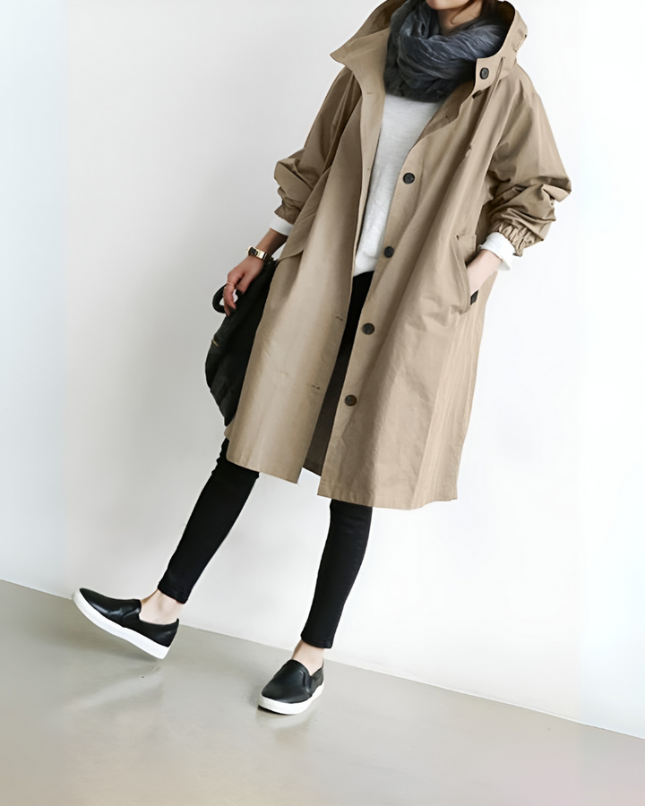 Comfortable loose fit women's hooded trench coat. Versatile long sleeve outerwear, perfect for fall and winter style.