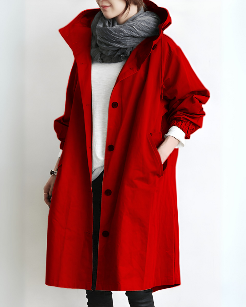 Full length view of women's classic hooded trench coat. Stylish outerwear with a loose fit for winter warmth.
